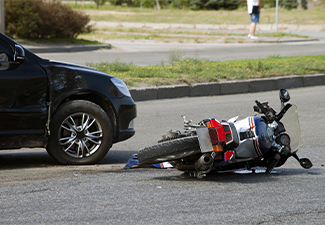 Crash moto bike and car on road