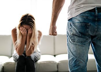 Man beating up his wife illustrating domestic violence