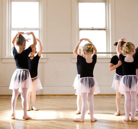 Portrait of group of children practicing a ballet dancing lesson