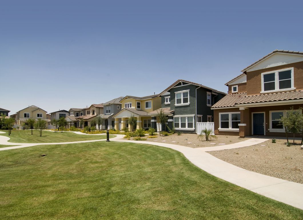 A row of houses are lined up next to each other in a residential area.