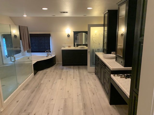 Pool with spa; concrete coping, blue water, and backyard setting.