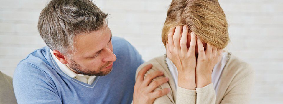 man reassuring his wife