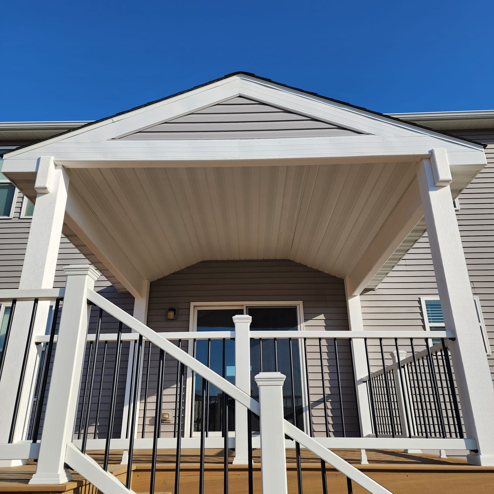 The front of a house with a porch and stairs