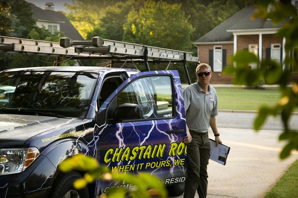 Man in uniform exits truck with