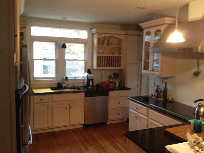 Light brown cabinets with black counter