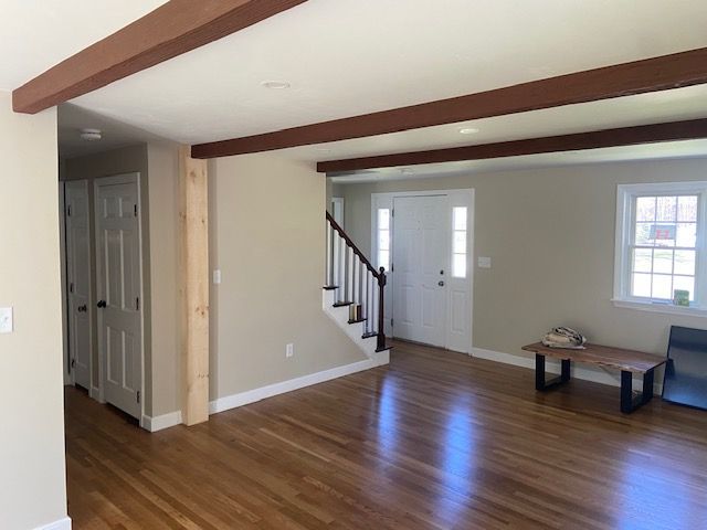 Living room with dark brown beams on the ceiling 