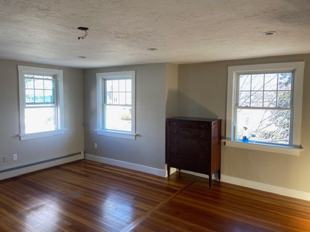 Bedroom area with dark brown hutch
