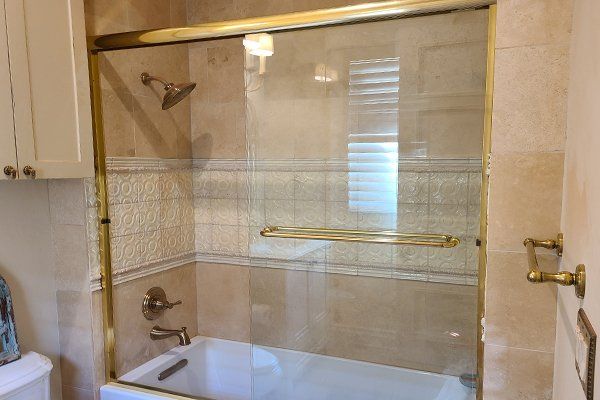 Framed shower enclosure