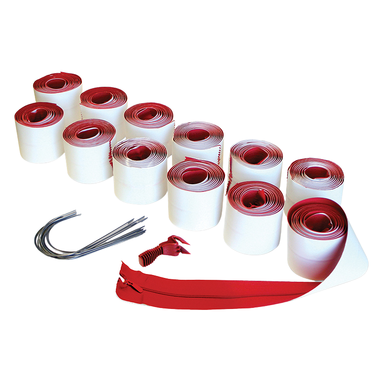 Rolls of red and white tape, wire and red zipper on white surface.