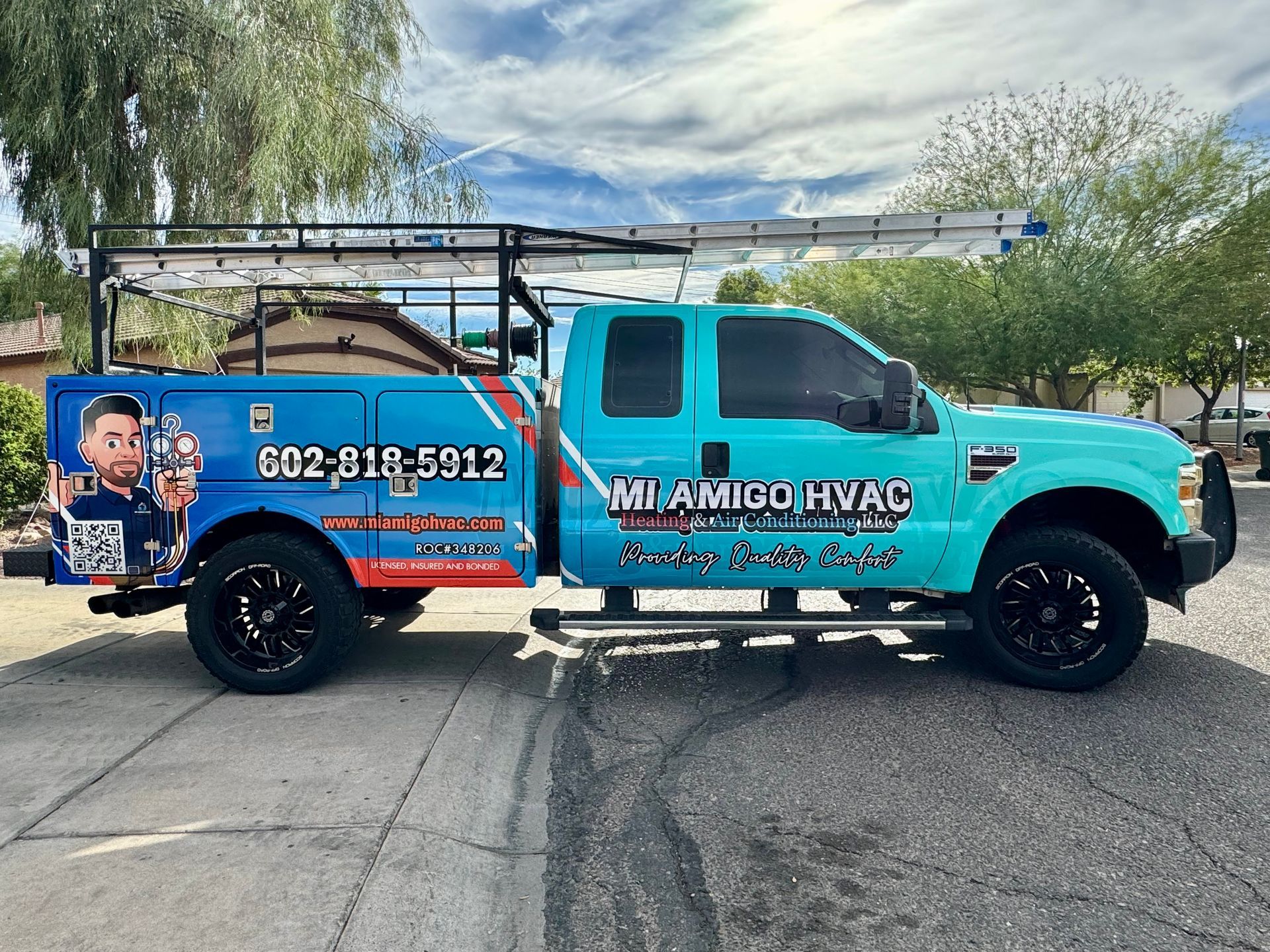 A light blue utility truck with 