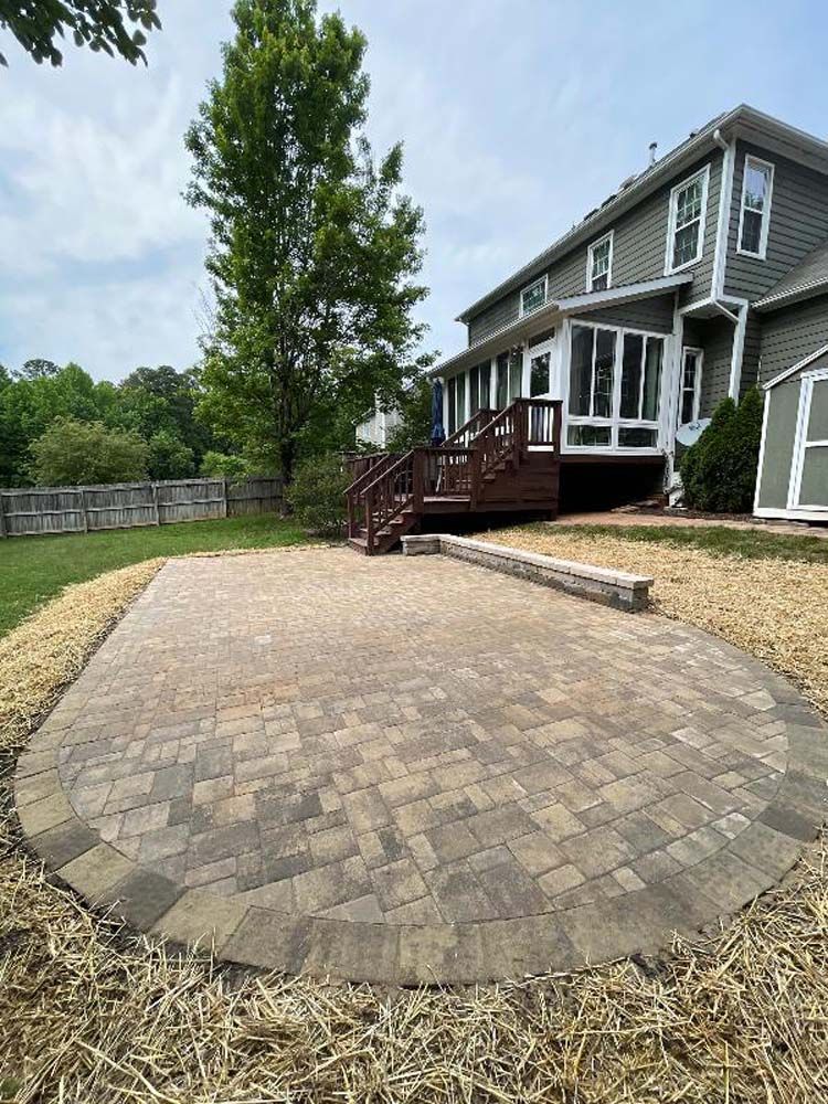 A large house with a large patio in front of it.