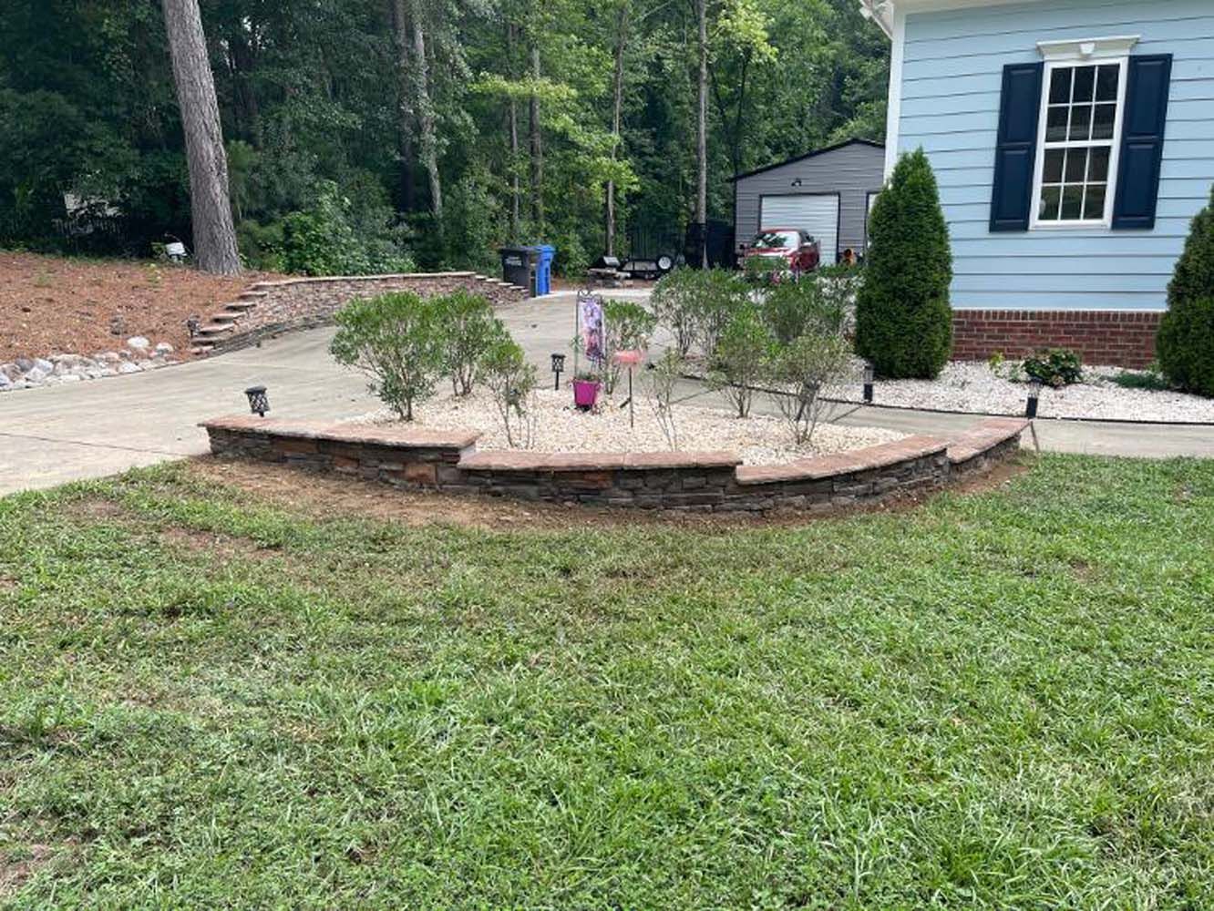A house with a lush green lawn in front of it.