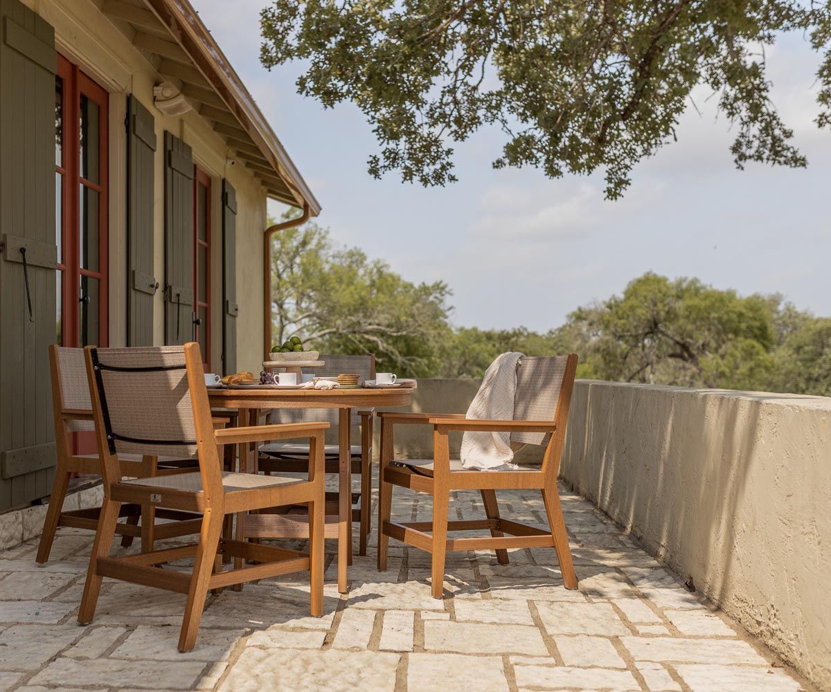 Mayhew Sling Counter Chairs with Harbor Table in Antique Mahogany recycled plastic on patio in Lewisburg, Pennsylvania.