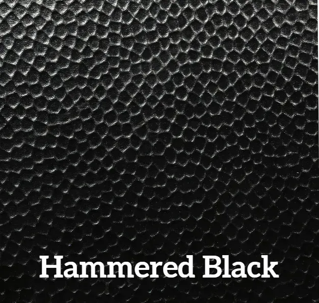 Close-up of hammered black textured surface.