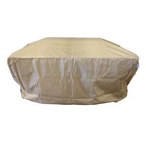 Beige fire pit cover on a surface, protecting the pit.