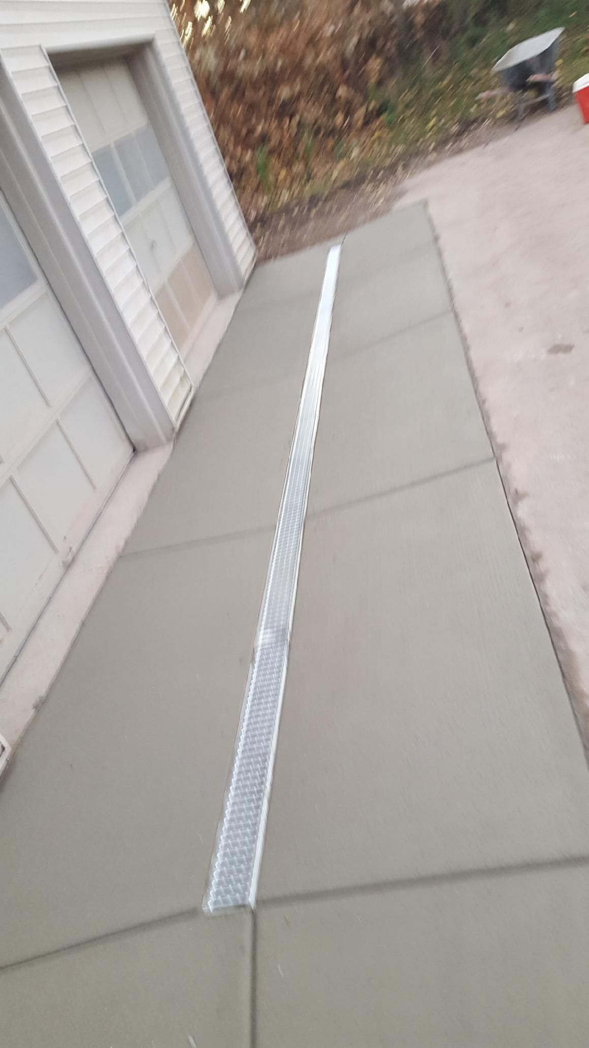 a concrete ramp to the garage