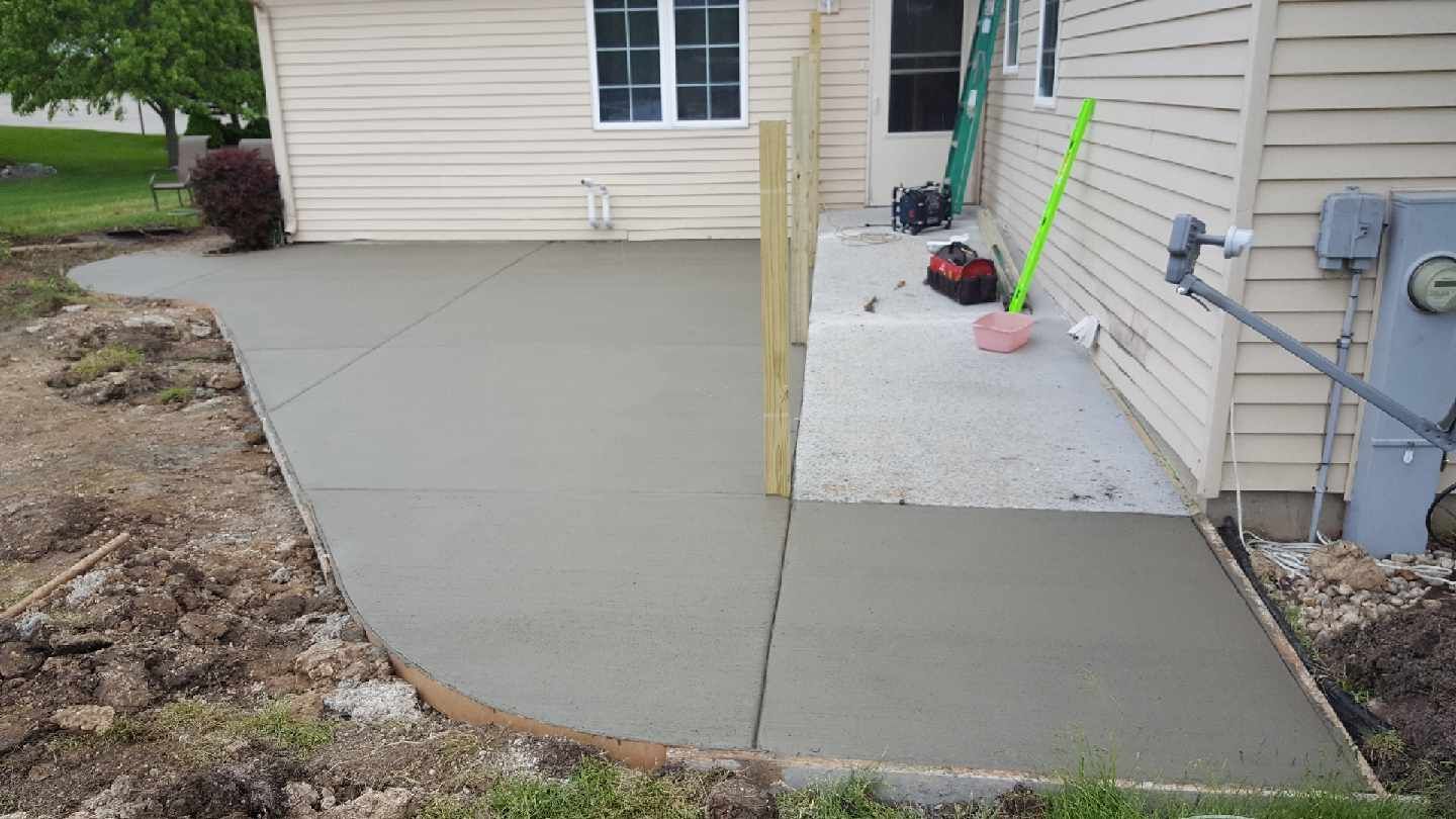 a concrete walkway and a patio