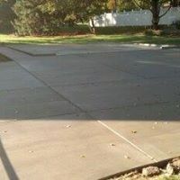 a patio with trees in the background
