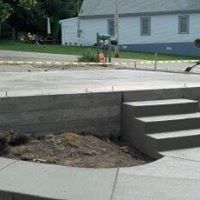 a concrete walkway with steps leading up to a concrete platform