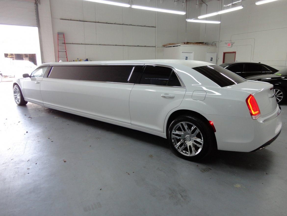 White limousine in a garage.