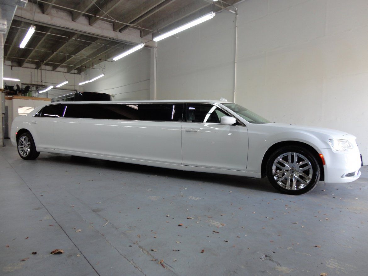 White limousine in an indoor setting.