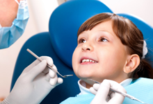 Child receiving a dental cleaning