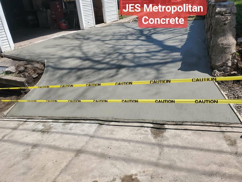 A concrete driveway is being built by jes metropolitan concrete