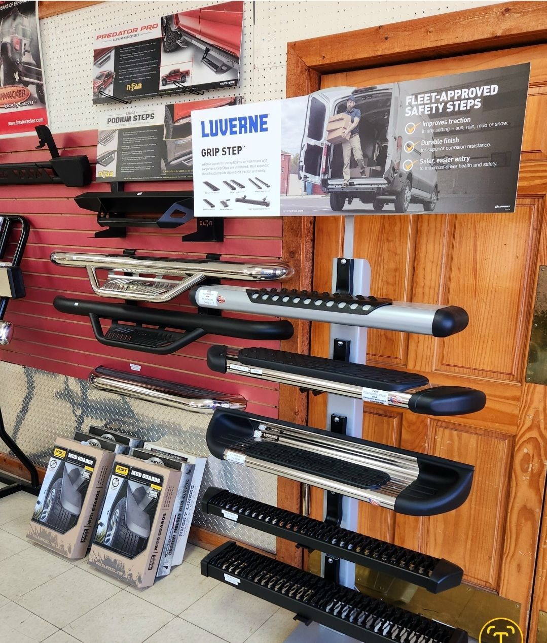 A display of side steps in a store with a sign that says Luverne