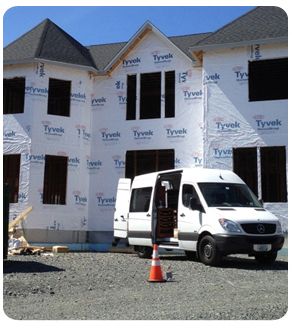 truck and house under construction
