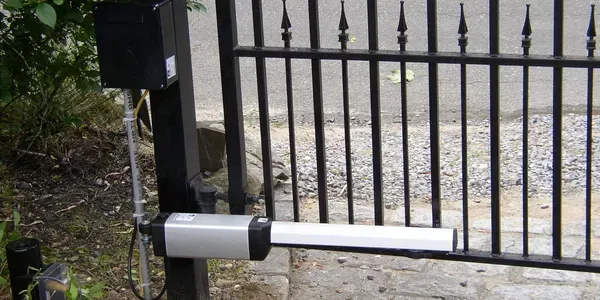 A close up of a gate with a motor attached to it.
