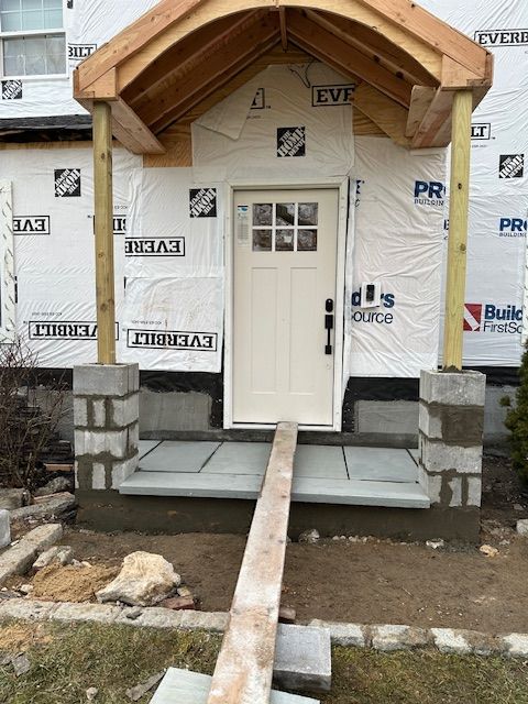 The front door of a house is being built.
