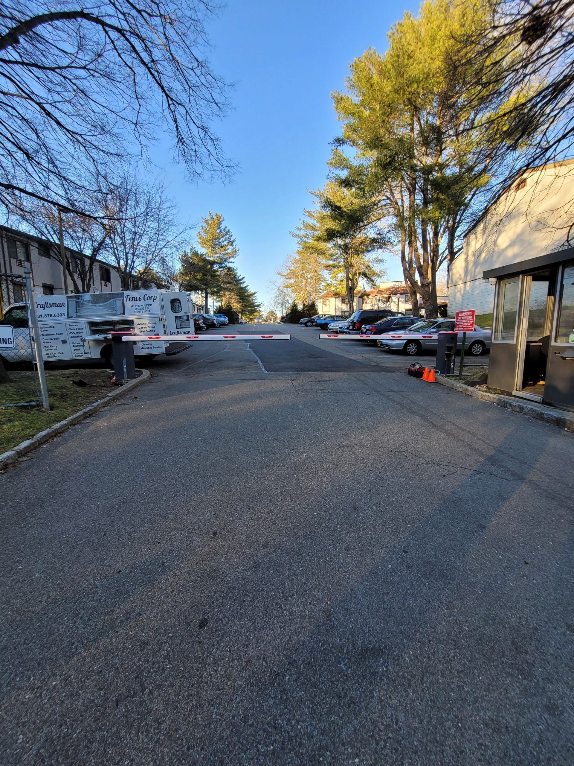 A street with a lot of cars parked on the side of it.