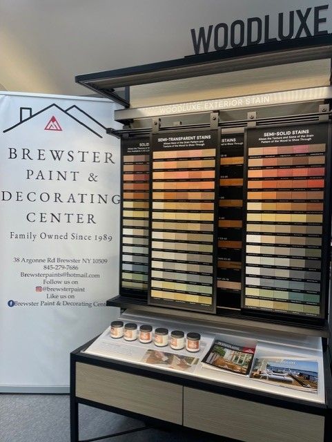 Brewster Paint & Decorating Center display showing paint swatches, jars, and brochures.