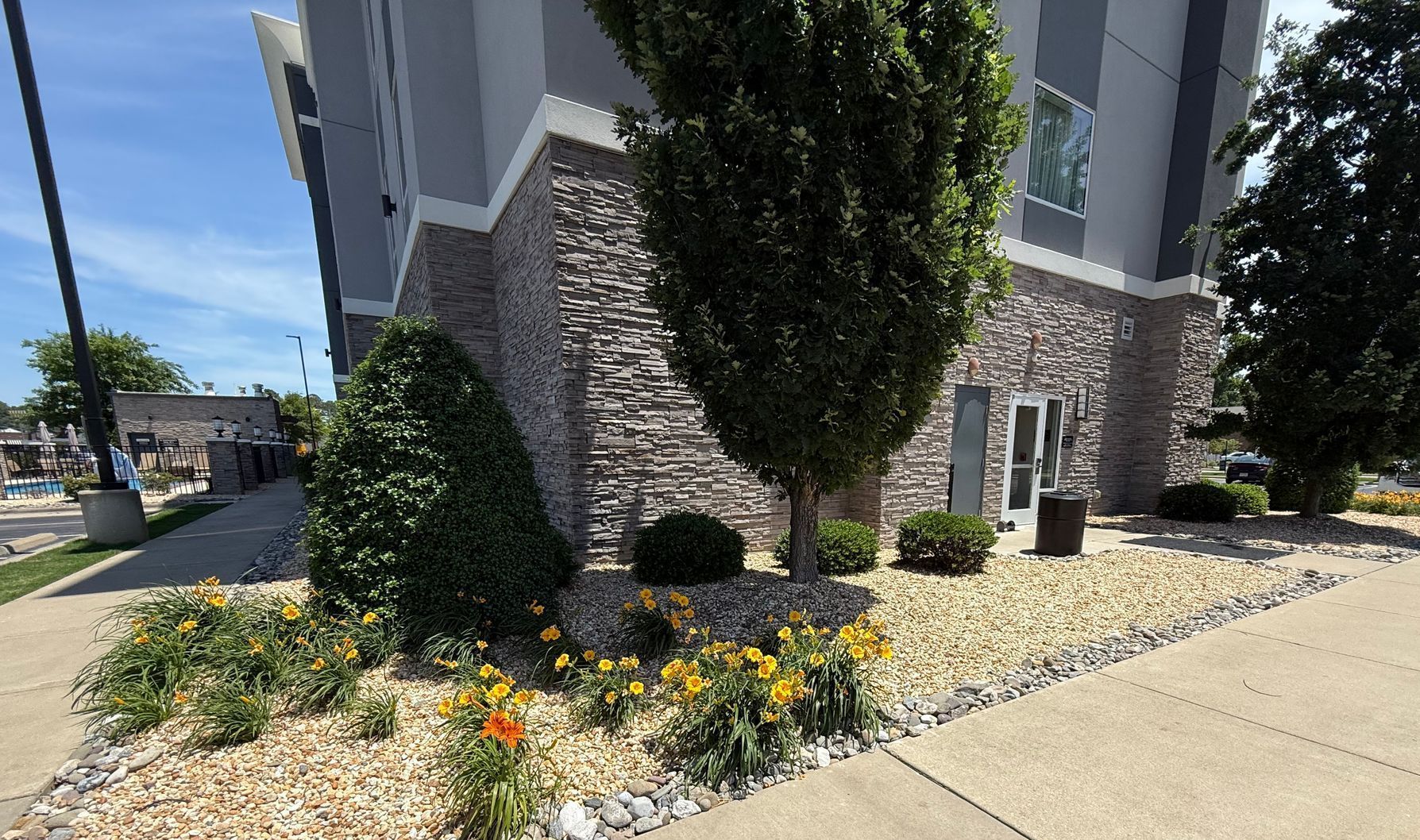 A building with a lot of flowers in front of it