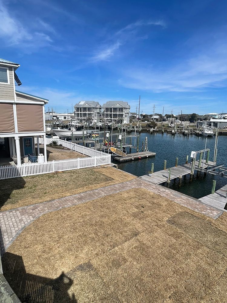 A view of a marina from a house on a sunny day.
