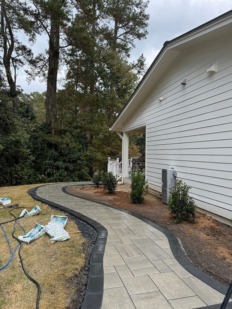 A walkway is being built in front of a house.