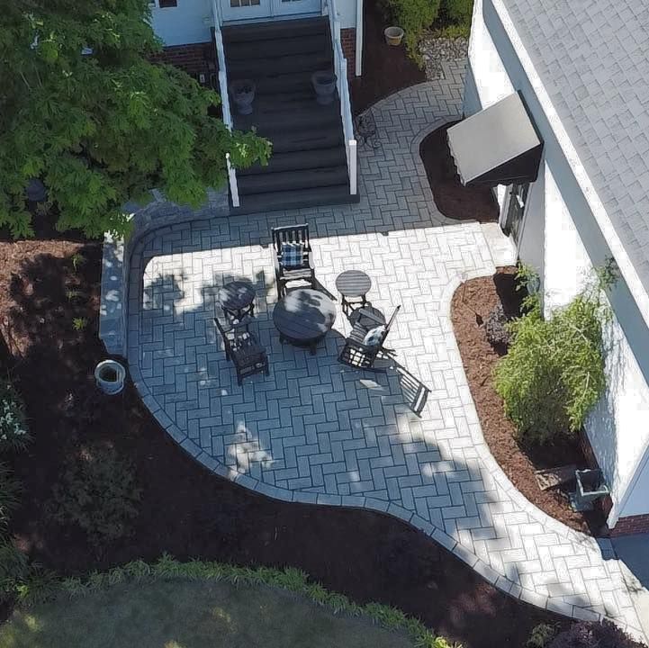 An aerial view of a patio with a table and chairs
