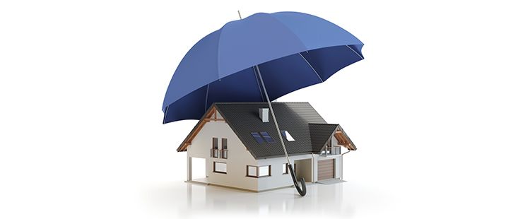 a blue umbrella is covering a model house .