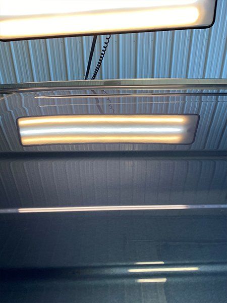 A light is hanging from the ceiling of a building