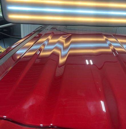 A red car with a light on top of it