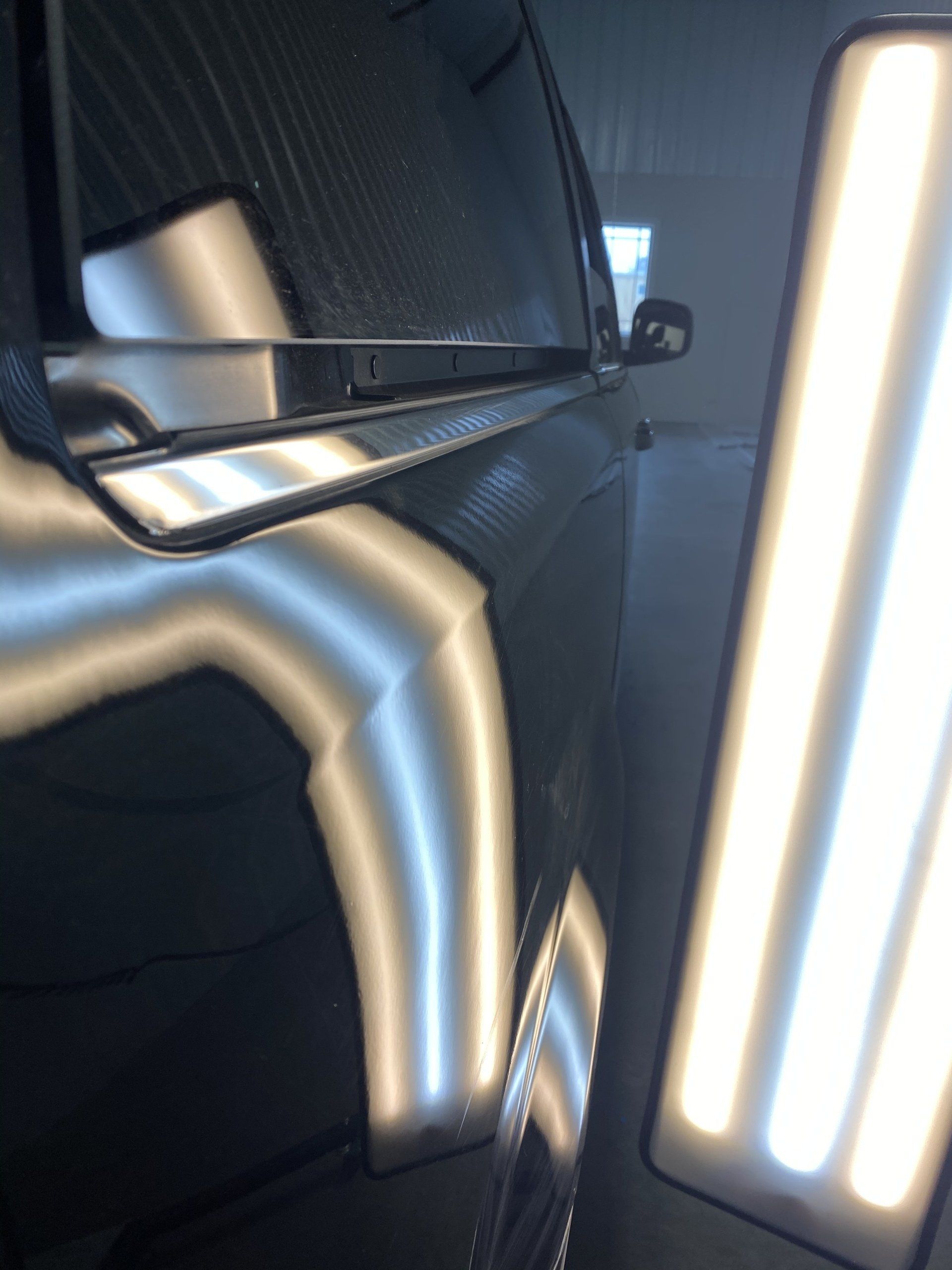 A car with a dent on the side of it