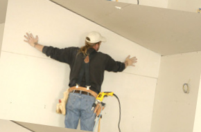 Man installing drywall