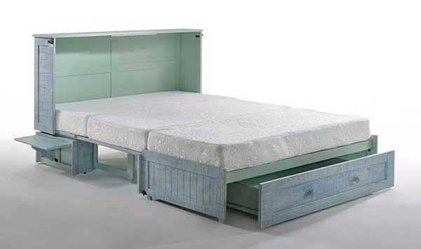 A bed with a mattress and drawers underneath it.
