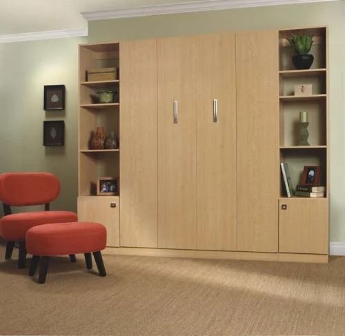 A living room with a red chair and ottoman