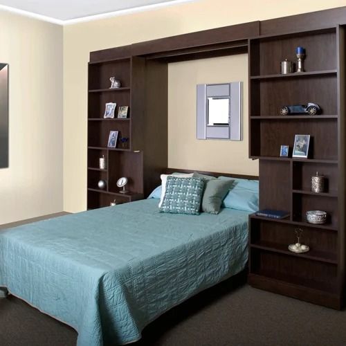 A bedroom with a bed and lots of shelves