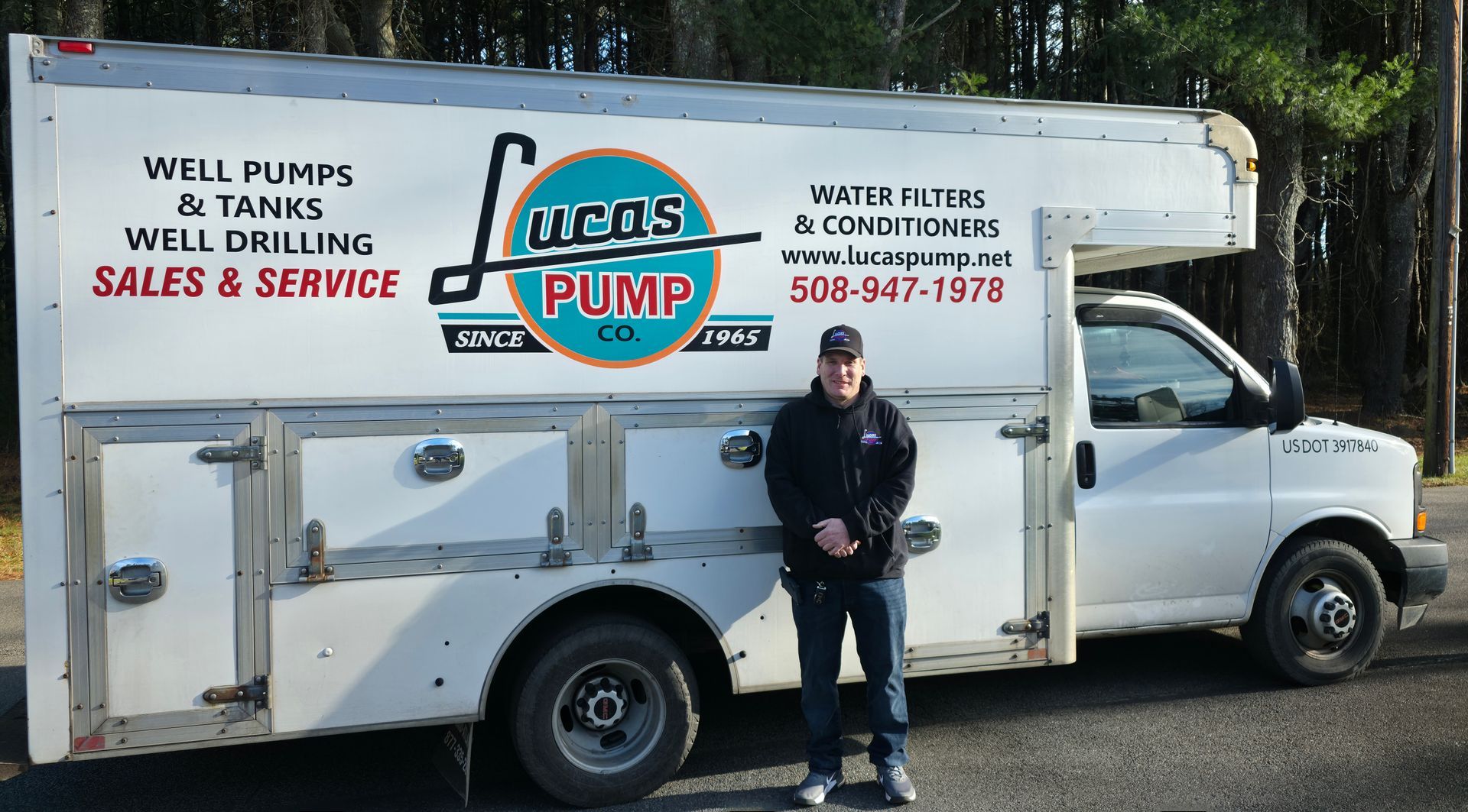 Man standing next to a white truck with 