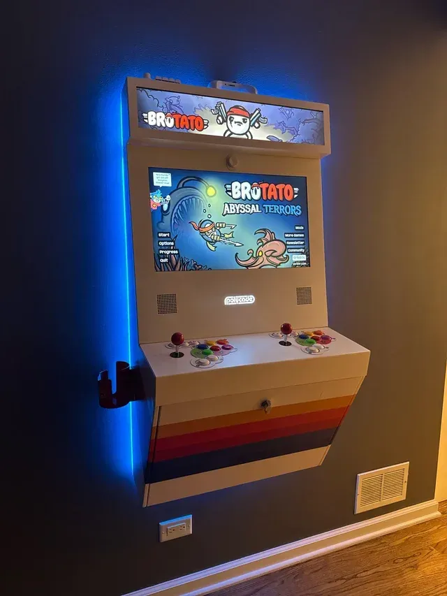 Wall-mounted arcade cabinet with a 