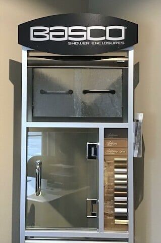 A basco shower enclosure is displayed in a store.