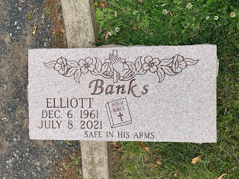 Elliott Banks grave marker with Bible design
