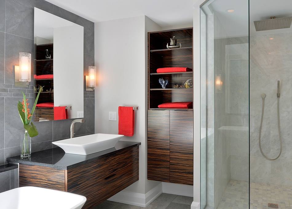 A bathroom with a sink and a walk in shower